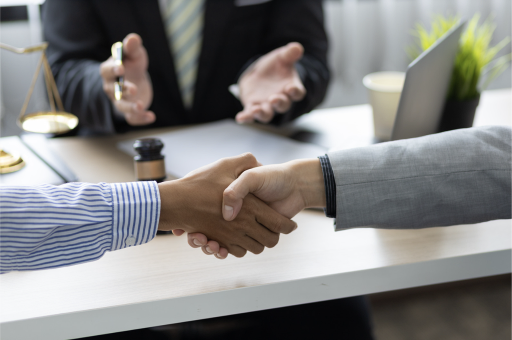 People shaking hands - Mediation vs. Litigation: Choosing the Right Path in Family Law
