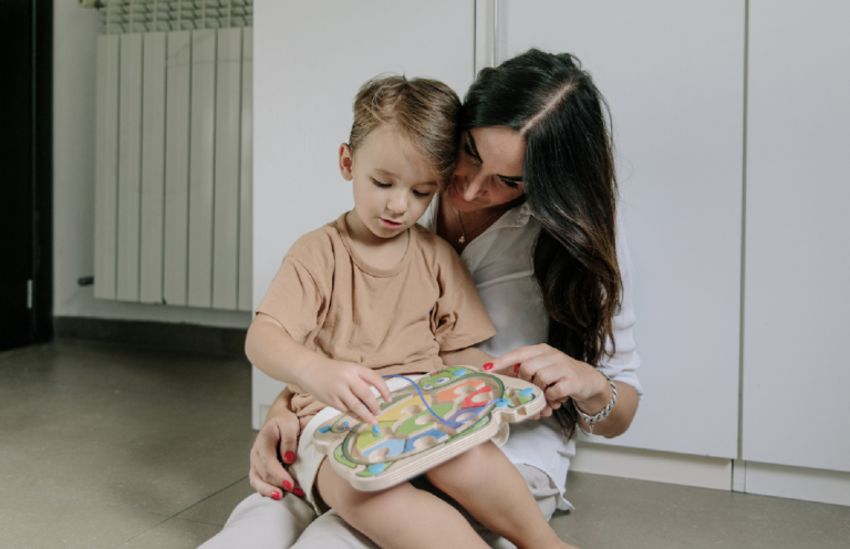 A mother and son playing together, symbolising the importance of parenting plans and child custody arrangements after separation.